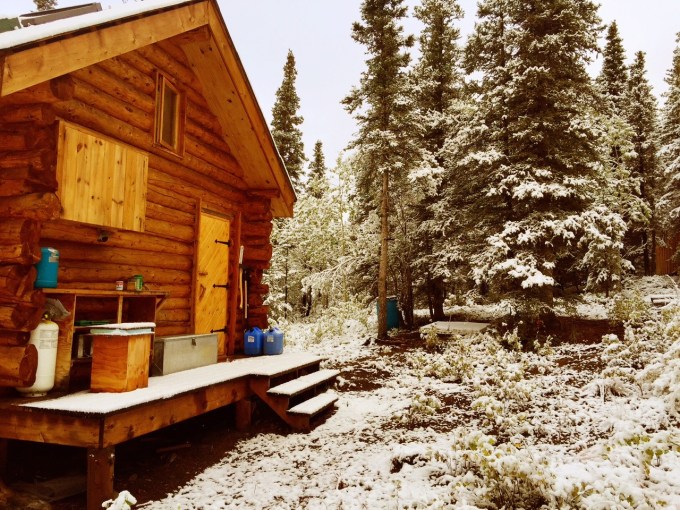 Photo of the Alaska cabin in snow
