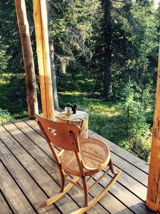 Photo of rocking chair, binoculars, and a glass of scotch